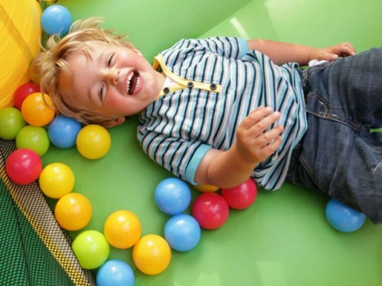 Laughing kid on bounce house